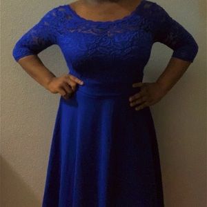 It’s a dark blue dress. Long sleeves. Cute. casual. Shows some part of the back.